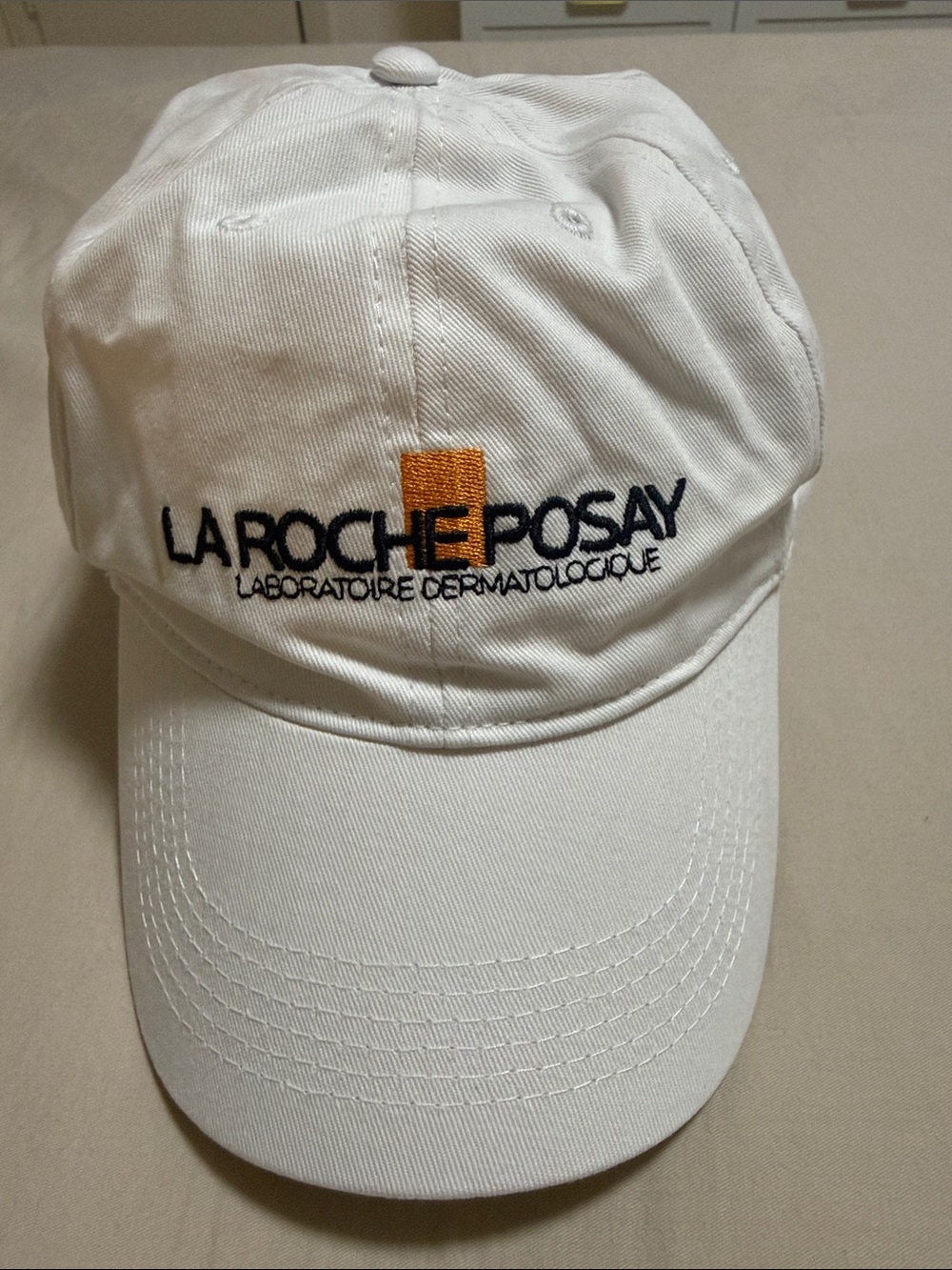 White Baseball Cap with Orange Accent